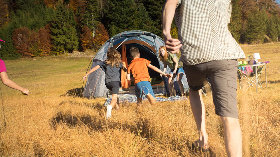 Cotswold Outdoor family camping in field